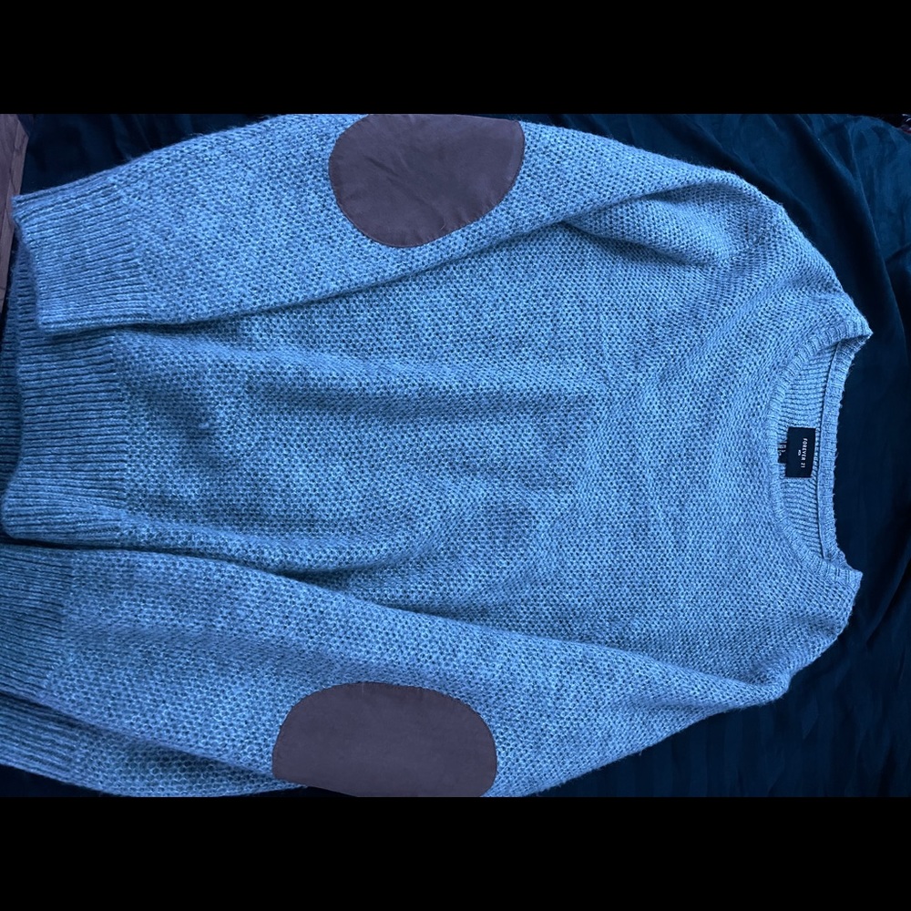 Cardigan with leather elbow pads.